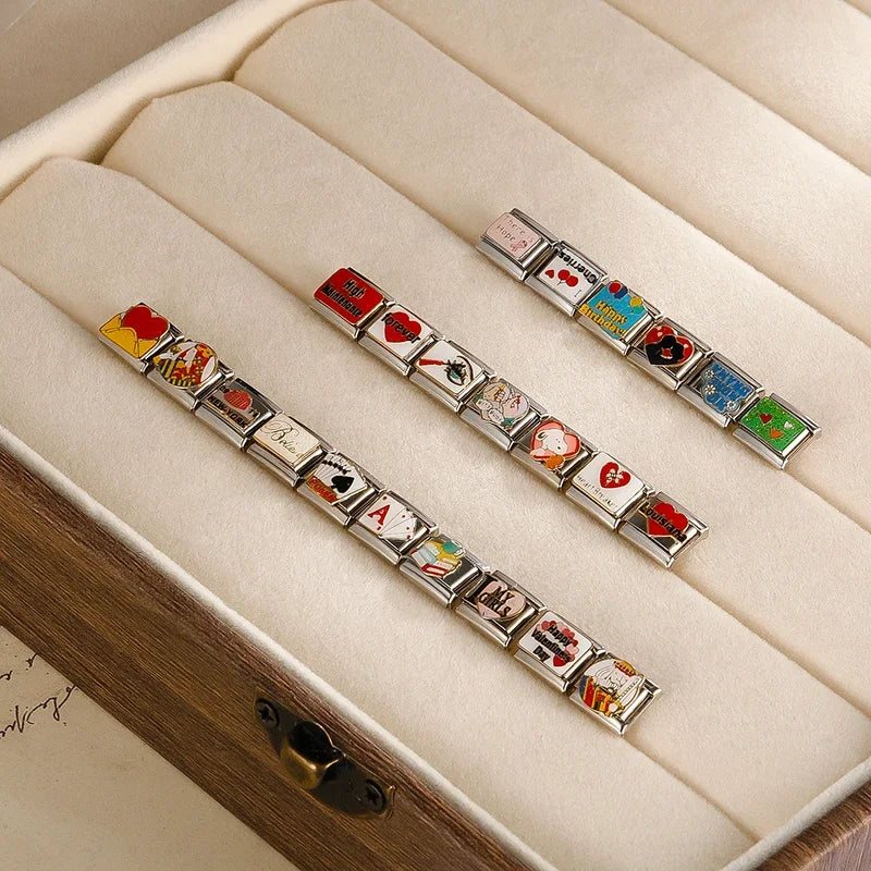 Charm links laid out in a jewellery box