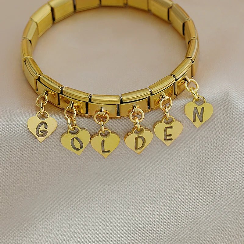Gold charm bracelet with heart letter charms